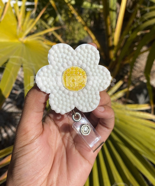 White flower badge reel